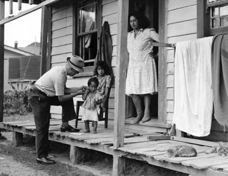 Image: Doctor checking Māori family, 1950