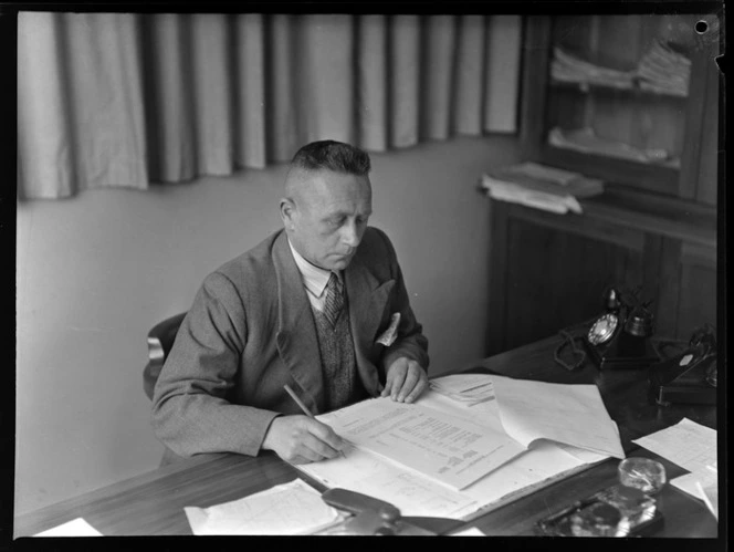 L G Skull Sitting At A Desk Checking Items National