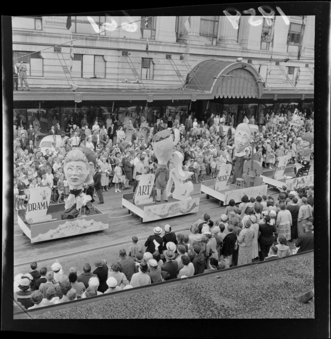 Festival of Wellington parade, showing parade floats representing the arts, and crowd of spectators, Lambton Quay, Wellington