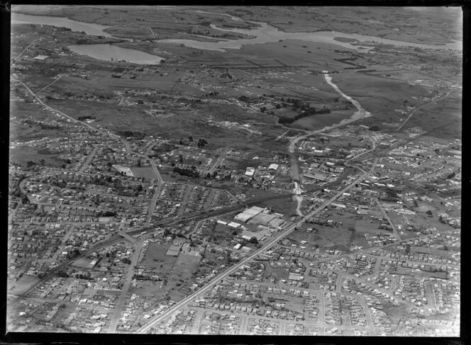 Showing Penrose Southern Motorway under construction, Auckland City area, with Great South Road and railway, intersecting with Pakuranga Highway, residential and commercial buildings, farmland beyond
