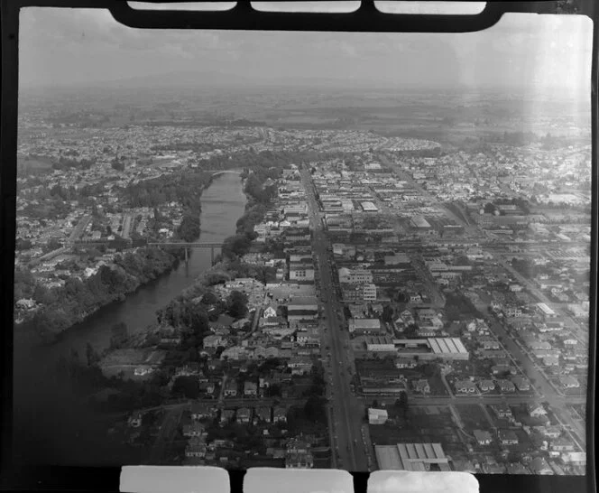 Hamilton, Waikato District, showing Waikato River with bridges, looking down Victoria Street, view south to Glenview and farmland beyond
