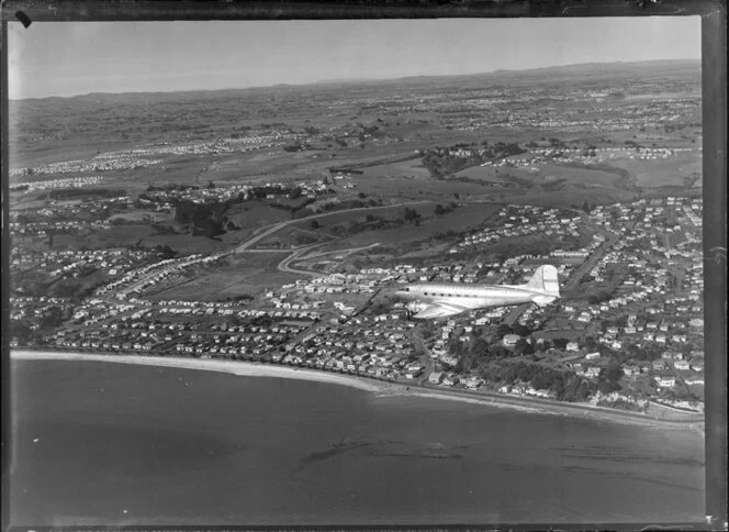 New Zealand National Airways Corporation (NAC) Flagship Dakota aircraft in flight over Auckland