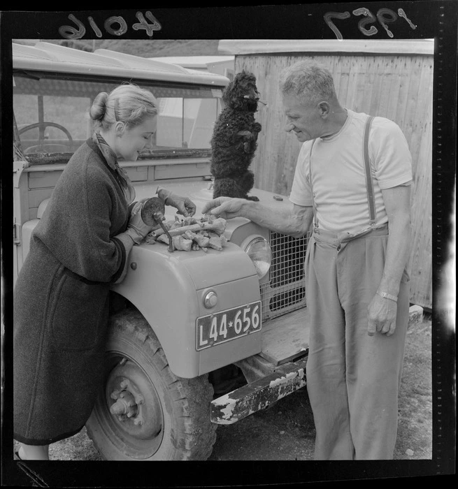 "Miss Susan Davis & Mr Fred Kilmister with bones of Maori from ancient burial place" (caption)