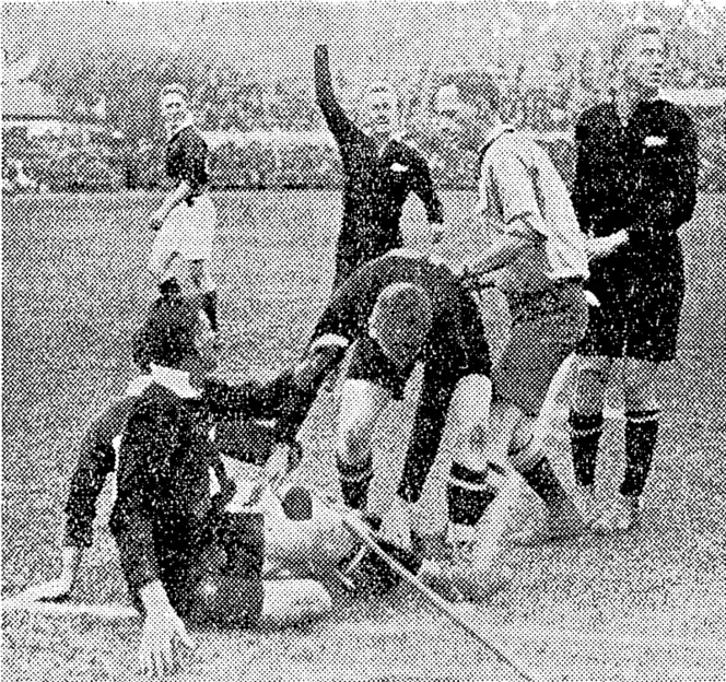 THEIR ONE AND ONLY.���The All Blacks' first taste of defeat m South  Africa was against Combined Capetown Clubs, who defeated them 7-3.  The glimpse is of the scoring incident, when Nicholls touched down. (NZ Truth, 19 July 1928)
