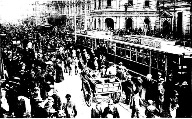 THE STRIKE OF THE AUCKLAND TRAMWAY EMPLOYEES.  This view shows the crowd in Queen street when the motormen and conductors left their oars on the signal for the strike being displayed (Otago Witness, 03 June 1908)
