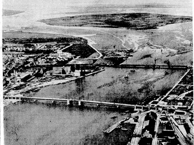 Two sections of Aalborg, in Denmark, the airfield of which has been bombed by the Royal Air Force, are shown, linked by the railway and mad traffic bridges over him Fiord. (Evening Post, 22 April 1940)
