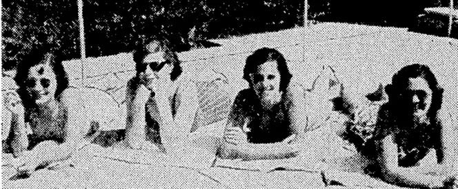Four "Tuis" relax alongside a swimming pool in the Middle East. From the left, Misses Peg Robertson (Lower Hutt), June Cummins (Wellington), Riro Girdleslone' (Eastbourne), and Dulcie Boucher (Hamilton). (Evening Post, 06 May 1944)
