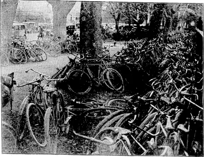 Green and Habn, Photo. A vaned assortment of bicycles outside Christ's College yesterday afternoon^urinn the football match between Christ's College and Christchurch Boys' High (Evening Post, 05 July 1929)