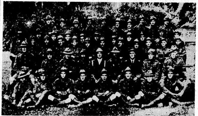Over fifty members of the Wellington Football Club were in the Advance Party of the New Zealand Expeditionary Force in 1914, and with one exception (C. Trembath), they are shown in the above photograph, taken at the time of the occupation of Samoa. 'A roll call today would not, be answered by all those in the big group, but there are many of them still here to take an interest in the game and their old club. The names of those in the unique group are:—Back tow: A. J. Walters, B. Brown, F. W. Packer, J. H. McKay (Stamp Duties Department), P. B. Shelley, I. V. Carley, H. S. Hyde, A, 0. D. Boddington, C. G. Robinson, E.f. Bridgman, B. C. Sheehan, W. T. Finlay (who died-in Wellington last week). Second row; T. R. Jackson, D. S. Hamilton, W. McMahon, E. G. Stewart, F. H. Barrell, W. G. Mace, H. 0. Wisely. L. Smith, E. R, McKillop (Assistant City Engineer), A. Tidman. Middle row: D. 0. Miller, E. M. Flanagan, T. P. Cox, C. J. H. Davidson, S. J. Smith, C. Tot hill, B. C. Drake, H. W. Kirkwoodrß. C. Watson. W. Morton, C. Langbein. (PublU Works engineer for Canterbury), P. C. Muir. Sitting: G. H. Weir (present captain of, the Wellington Football Club), J. Forbes, W. /, R. Hill, H. H. Christophers, A, A. Mc!\'ab, J.G. Roache (present member of the New Zealand Rugby Union), G..H. Forsylhc, I, Thompson (Wellington Club's president), J. C. O'Lcary. In front: H. jllanucra. '/'". L Chapman, j. R. Perston, N. Broad, W. H, McLeiv, L. S. Bridge,'L. A. Henderson, and F.K. Chipman. (Evening Post, 28 August 1937)