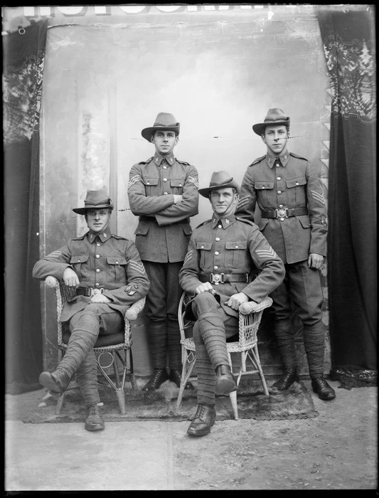 Studio portrait of four unidentified soldiers in uniform, probably Christchurch district