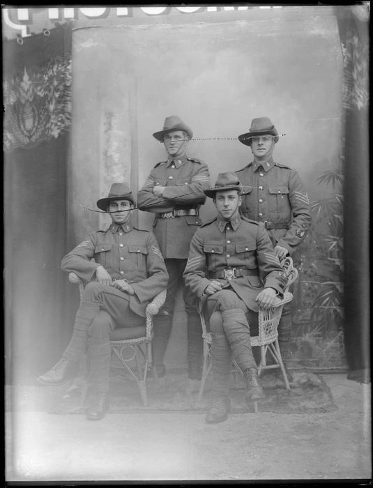 Studio portrait of four unidentified soldiers in uniform, probably Christchurch district