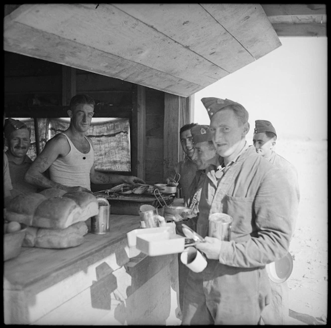 Artillery men queue up at cookhouse, Western Desert