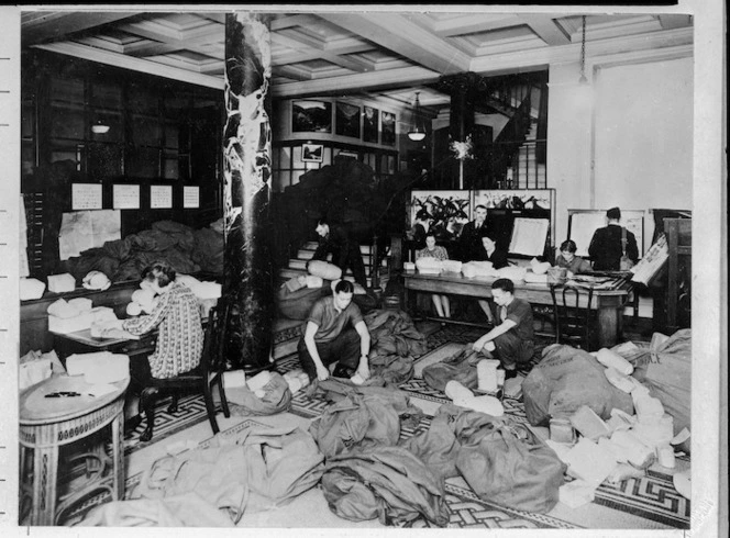 Staff of New Zealand House in London sorting mail for armed forces personnel in the UK