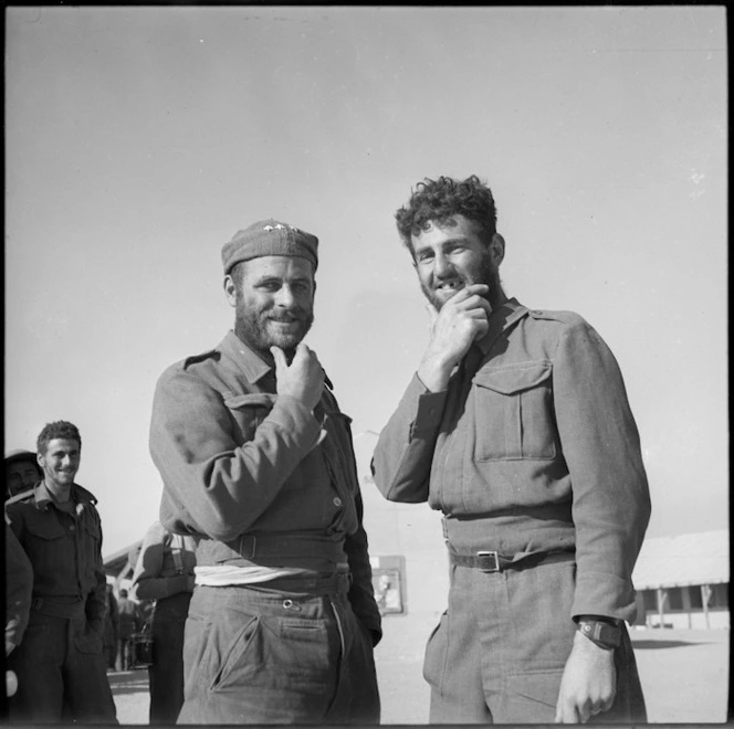 Two New Zealand soldiers back at Base Camp display beards grown during imprisonment in Libya - Photograph taken by M D Elias