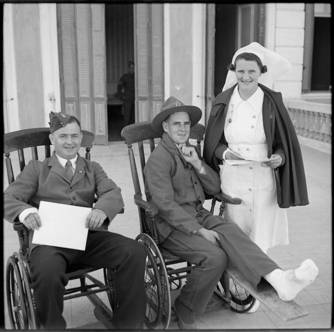 Sister A M Buckley with certificates of award to NZ soldiers at Helwan Hospital, Egypt - Photograph taken by M D Elias