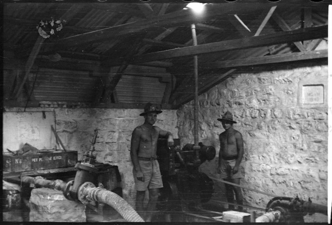 Plumbers inside relay pumping station at Burbeita Oasis, Egypt - Photograph taken by M Walker