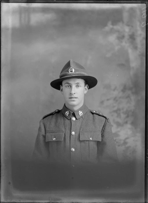 Head and shoulders studio portrait of unidentified soldier, in uniform, probably Christchurch district