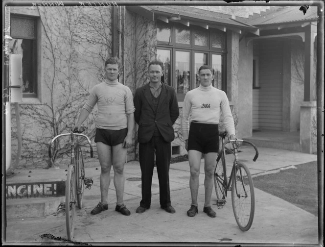 Bicycle race champions, including Hunter, standing with their bikes