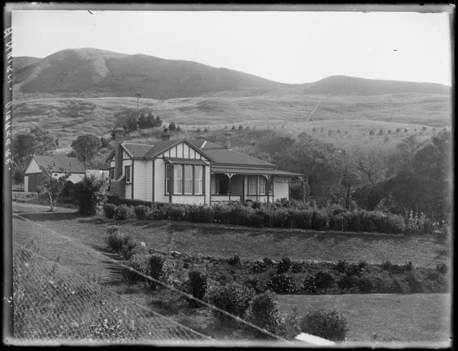 Family farm of A Nairn, with sloping front garden and farmland hills beyond, Omakere, Patangata, Hawke's Bay District