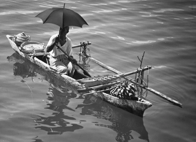 Man in a canoe, Apia, Western Samoa