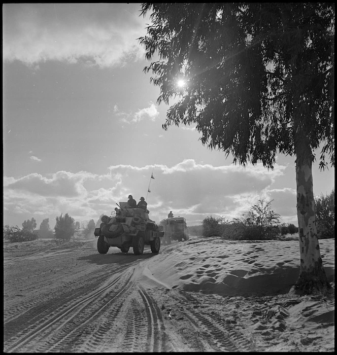 British armoured car advances on Tripoli with NZ Division, World War II - Photograph taken by H Paton
