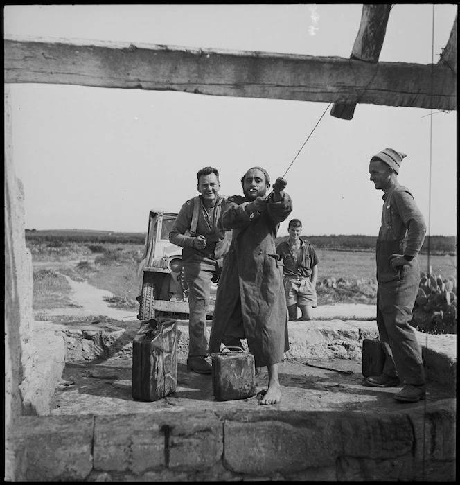 Local Tunisian assists New Zealander to draw water from well in Tunisia - Photograph taken by M D Elias