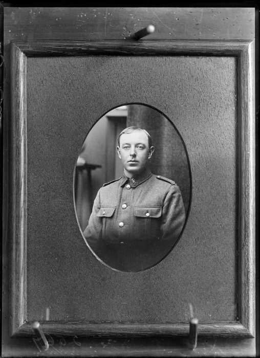 Oval masked upper torso studio portrait of unidentified WWI soldier with collar and shoulder badges, Christchurch