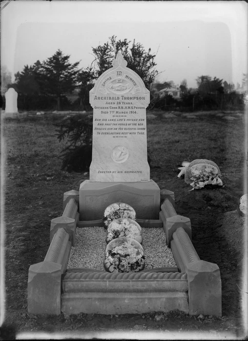 View of the grave with flowers and headstone of Archibald Thompson, Officers' Cook R N, HMS Psyche, who died at the age of 28 on the 7 March 1914, erected by his shipmates, Sydenham Cemetery, Christchurch