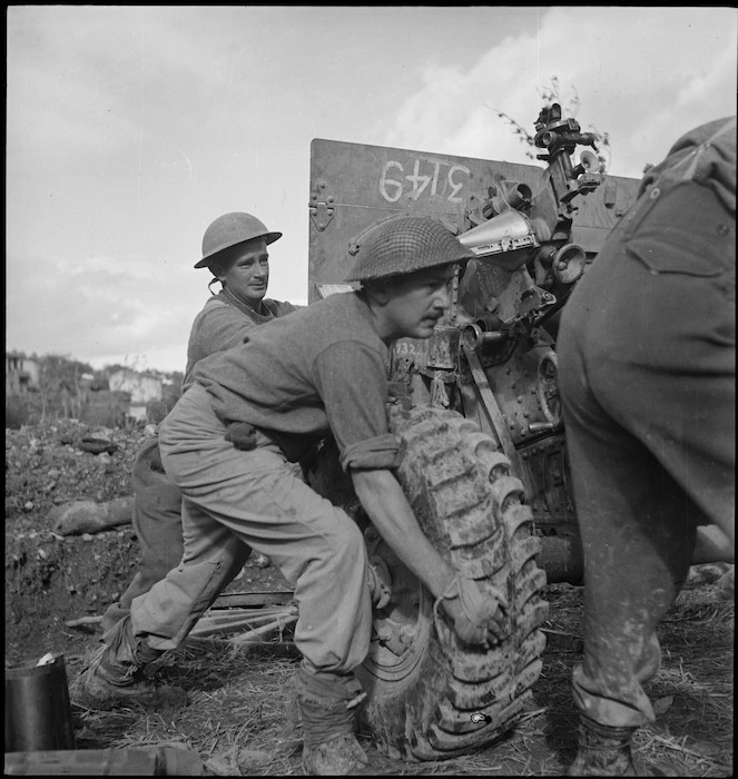 NZ Artillerymen moving gun in the Sangro River area of the Italian front, World War II - Photograph taken by George Kaye