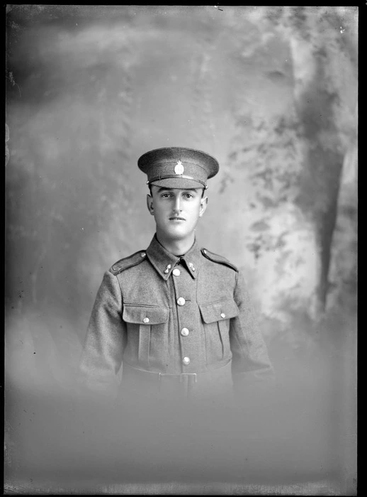 Studio upper torso portrait of unidentified World War One soldier with hat with badge and collar insignia, Christchurch