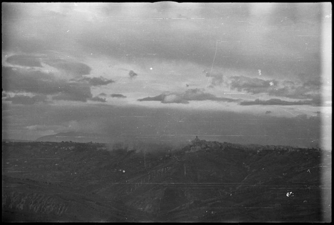 Orsogna almost obscured by smoke from joint air and artillery attack, Italy, World War II - Photograph taken by George Kaye