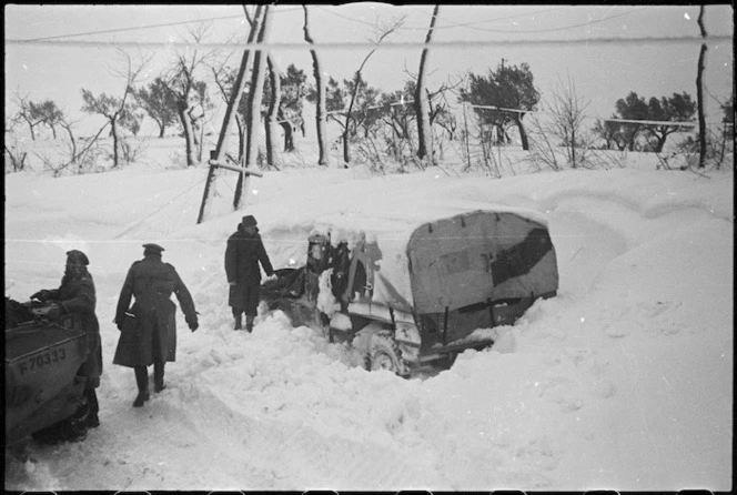 NZ Division vehicle dug out from snow drift in NZ Sector of the Italian Front, World War II - Photograph taken by George Kaye
