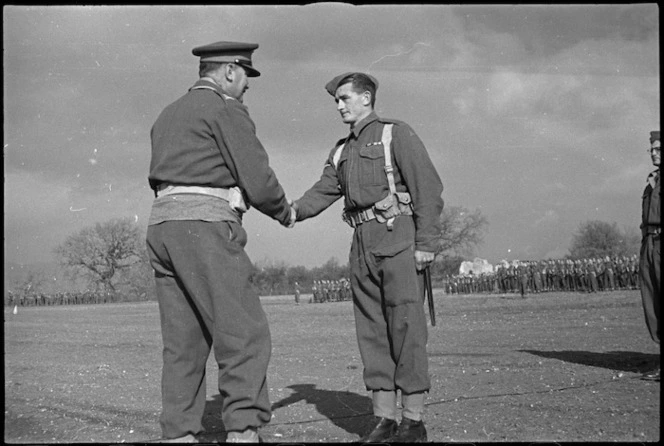 General Freyberg congratulates Lance Corporal M H Crockett, MM, after decorating him, Volturno Valley, Italy, World War II - Photograph taken by George Kaye