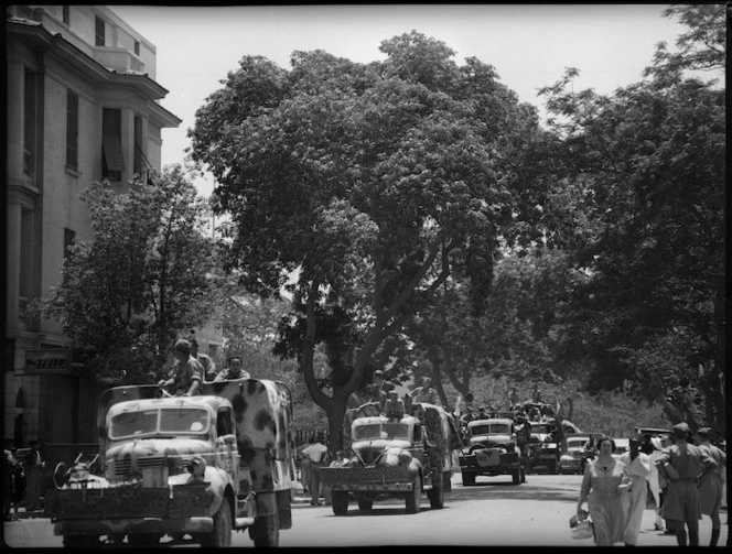 Trucks of the New Zealand Division passing through Maadi, Egypt, at the end of North African campaign, World War II - Photograph taken by H Paton