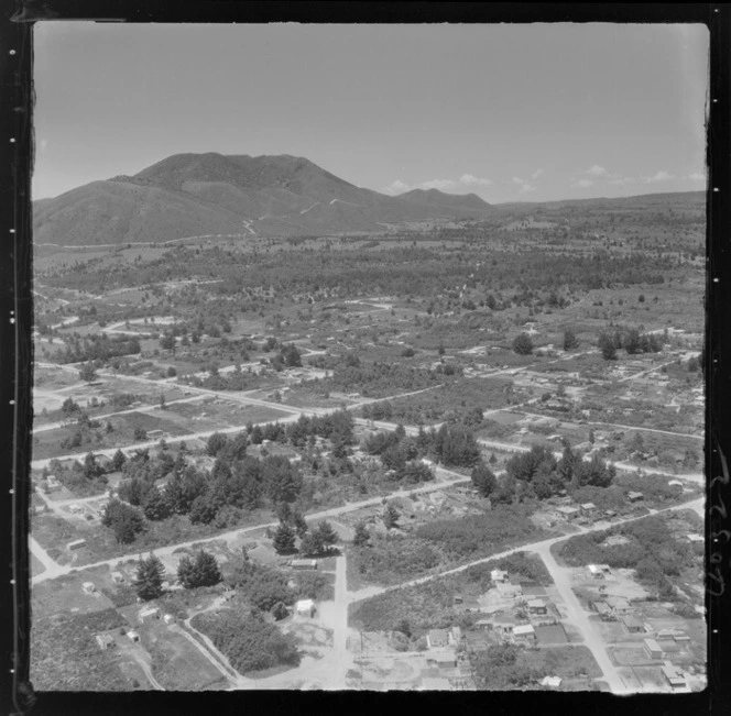 Taupo, includes housing, farmland, pine trees, roads and Mount Ruapehu