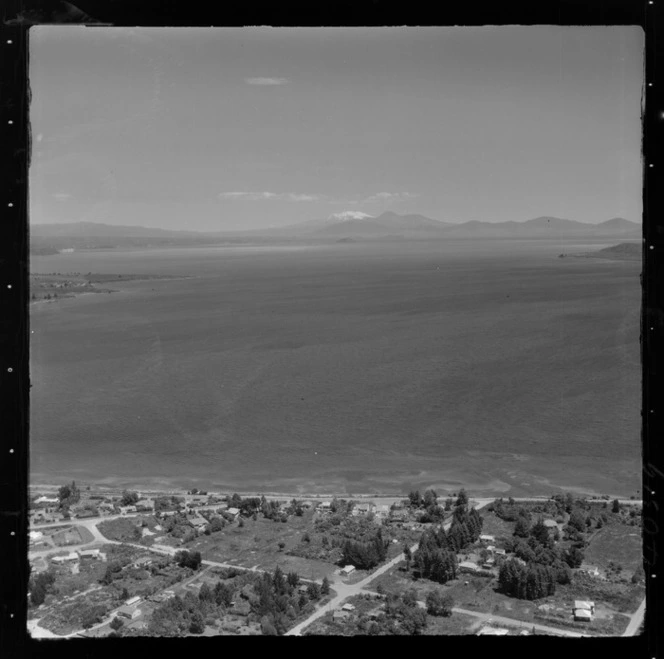 Taupo, includes view of lake, roads, housing and Mount Ruapehu