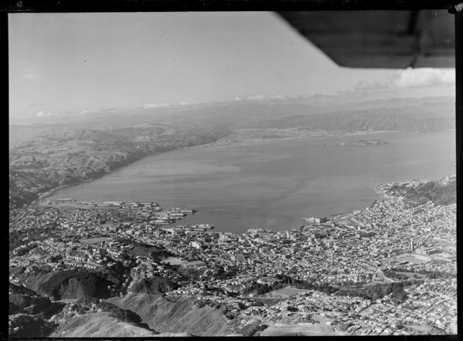 Wellington City and Harbour with wharf area in foreground to Somes Island and the Hutt Valley beyond