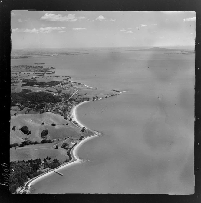 Maraetai coastal settlement, beach and jetty, with Rangitoto Island and the Hauraki Gulf beyond, Auckland Region