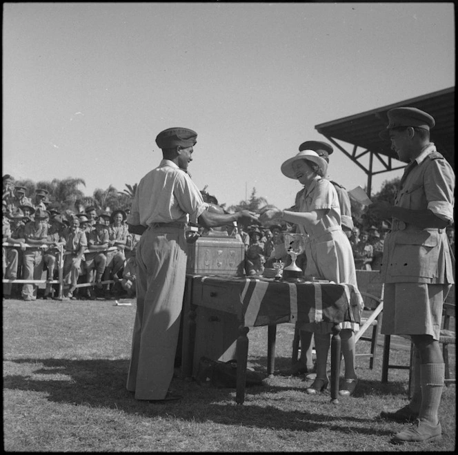 Lady Freyberg presenting trophies to C Masters at NZ Division Athletics Championships, Cairo, Egypt, World War II - Photograph taken by George Kaye