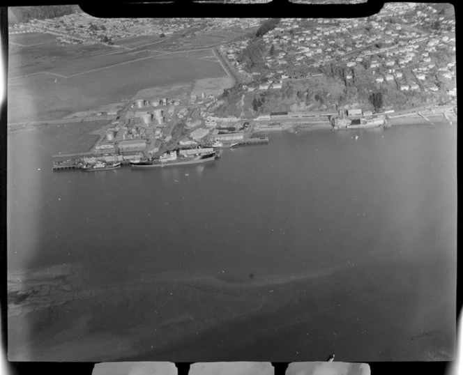 Port of Nelson docks and industrial area with the Maitai River Estuary, Nelson City and suburbs beyond, Nelson Region