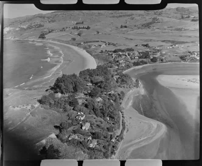 Karitane coastal settlement and the Waikouaiti River Estuary with Huriawa Historic Reserve Headland in foreground and Karitane Beach beyond, Otago Region