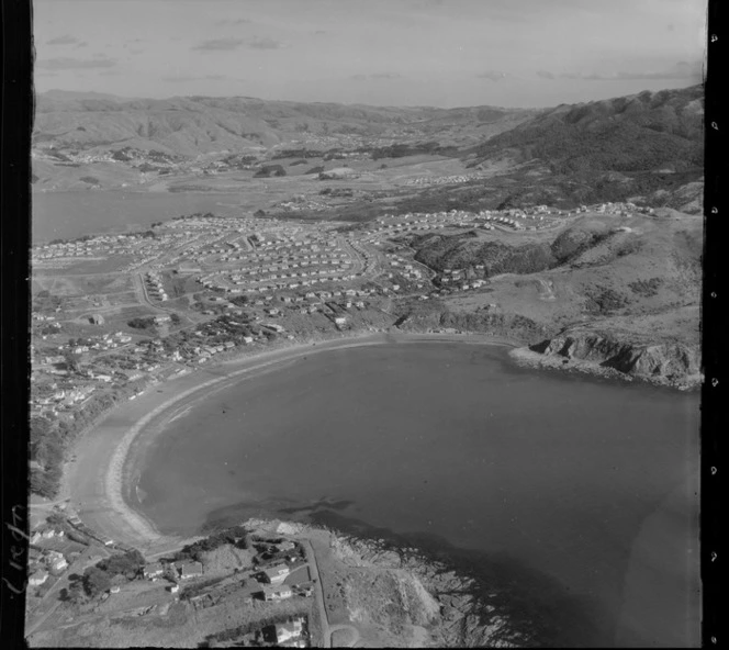 Titahi Bay coastal settlement with Terrace Road on headland in foreground looking to Porirua Harbour beyond, Wellington Region