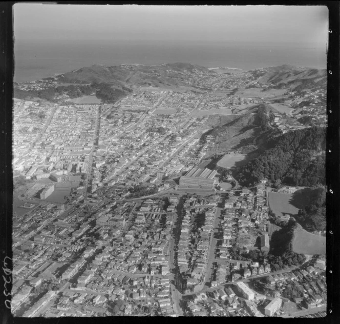 Wellington City southern suburbs of Mount Cook and Newtown in foreground and Riddiford Street with Newtown Hospital to Athletic Park and Island Bay on the south coast beyond