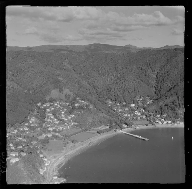 Days Bay with Marine Drive road, wharf and Wellington Harbour, Days Bay Pavilion and gardens, tennis courts and Wellesley College, Eastbourne, Wellington Region