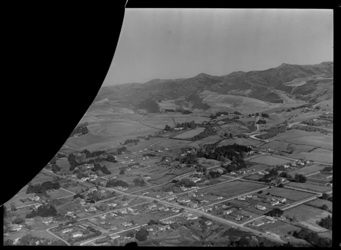 The Auckland-Hamilton Motorway through residential area with farmland beyond, South Otahuhu, Auckland City