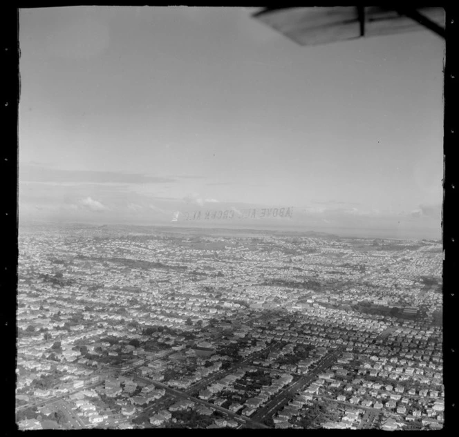 Aircraft Services aerial advertising, showing banner reading 'Above All Crown Ale' above Auckland