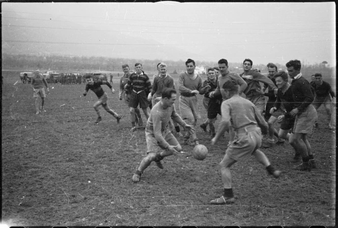 Members of NZ Public Relations Service play rugby football behind the lines on the Italian Front, World War II - Photograph taken by George Kaye