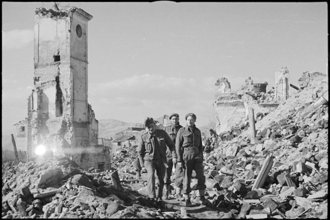 New Zealand soldiers in the main street of the ruined village of Mignano in Italy, World War II - Photograph taken by George Kaye