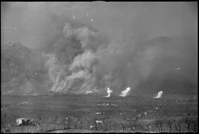 Bomb bursts and smoke from shells during bomber raid on Cassino, Italy, World War II - Photograph taken by George Kaye