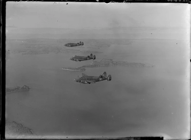 Three Lockheed Hudson aeroplanes, in flight over an unidentified location